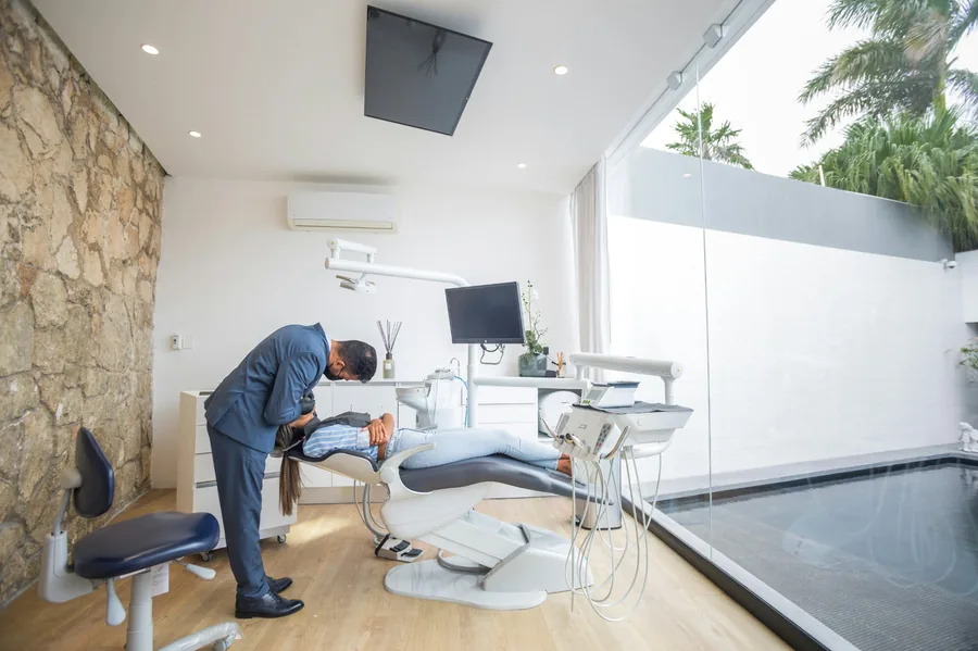 Dentist treating a patient in a modern dental surgery in Barcelona